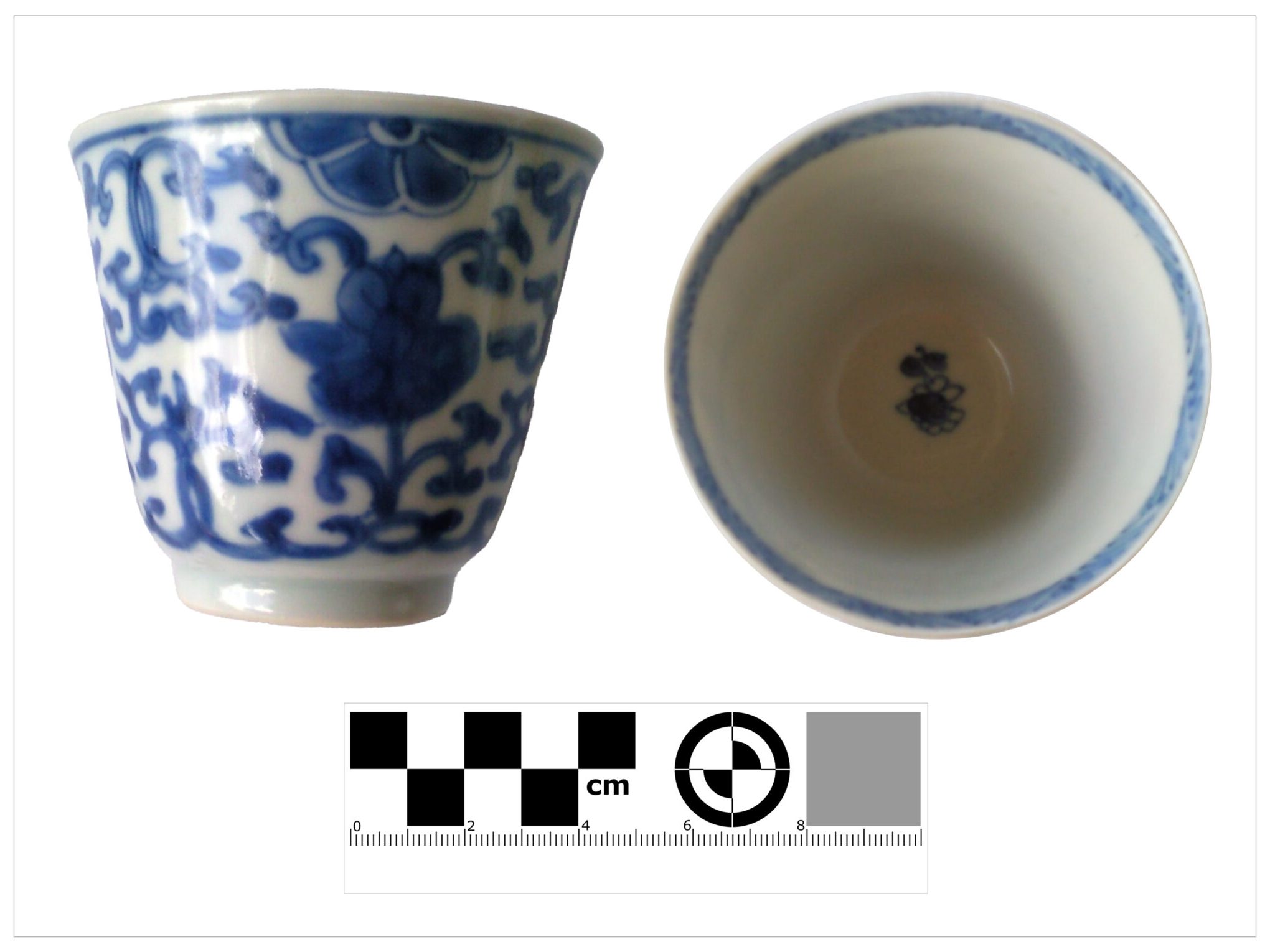 Blue and white floral-patterned ceramic cup with top and side view, ruler for scale.